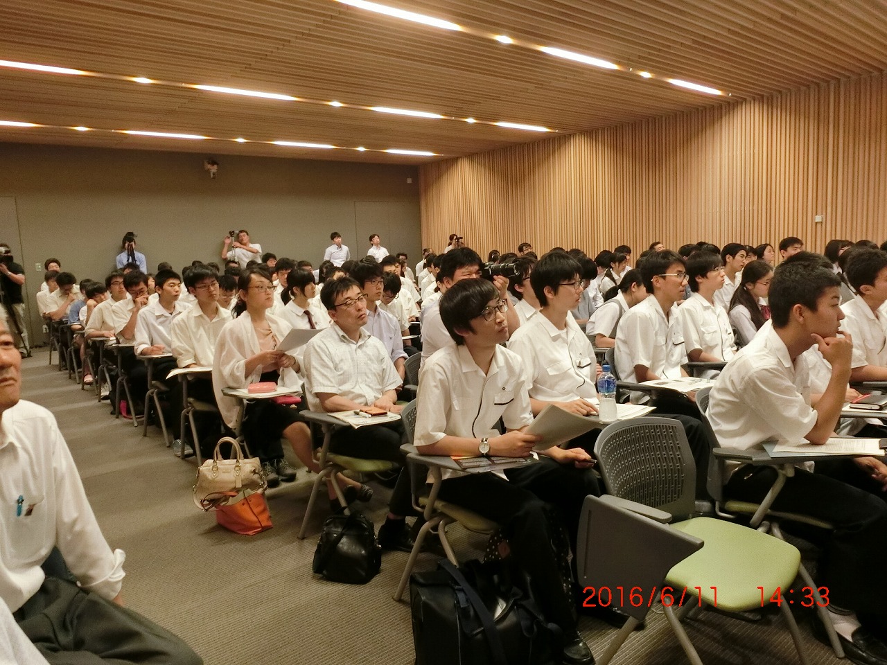 Japanese high school students listening in the temple at Nara as Dave Crisp and others talk about measuring carbon dioxide levels from space. 